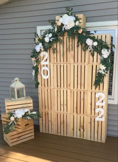 a couple of wooden crates with flowers on them