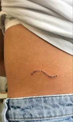 the back of a woman's thigh with an inscription on it that says, always and forever