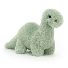 a green stuffed animal on a white background