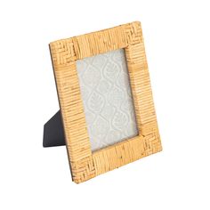 a wooden frame with a pattern on the front and bottom, sitting against a white background