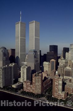 two twin towers towering over the city of new york