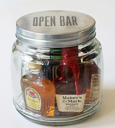 an open jar filled with liquor bottles and labeled minibar in a jar grooms man gift idea