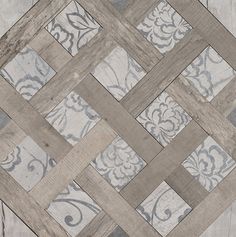 a close up view of a tile floor with an intricate design on the top and bottom