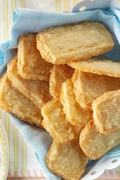 a bowl full of crackers sitting on top of a table