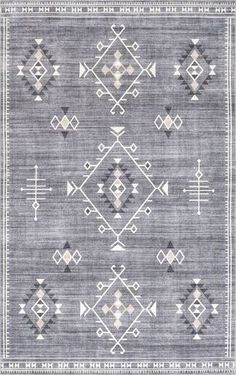 a gray rug with an intricate design on the front and back side, in different colors