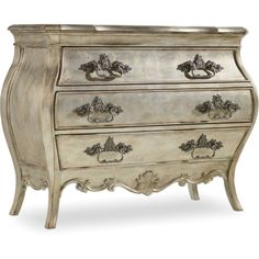 an antique chest of drawers with ornate carvings on the front and sides, painted white