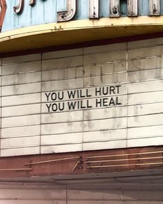 a sign on the side of a building that says you will hurt you will heal