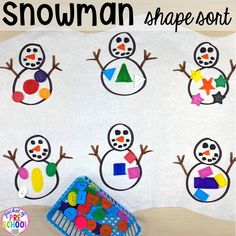 the snowman shape sort is displayed on top of a white sheet with colorful shapes