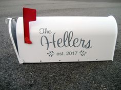 a white mailbox with the words the hellers on it