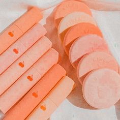 several pieces of candy sitting next to each other on a white tablecloth with writing on them