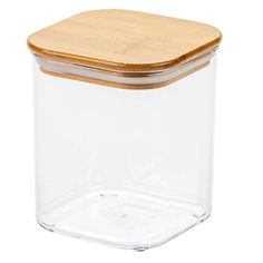 a glass container with a wooden lid on a white background for food storage or cooking