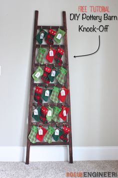 an old ladder is decorated with christmas stockings and stocking for the holiday tree ornament