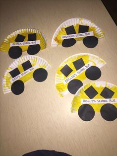 paper plates with construction vehicles on them sitting on a table