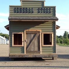 a small building with a wooden door and windows