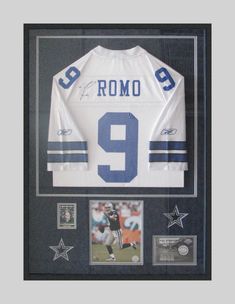 a signed jersey is displayed in a black frame with silver stars and the number 9 on it