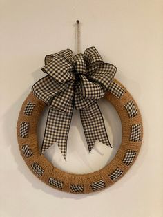 a black and white checkered wreath hanging on the wall