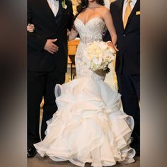 a bride and groom standing next to each other in front of the alter at their wedding