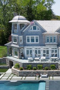 an aerial view of a large house with a swimming pool