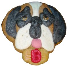 a cookie shaped like a dog's face with its tongue out