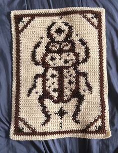 a crocheted square with an image of a skeleton on it