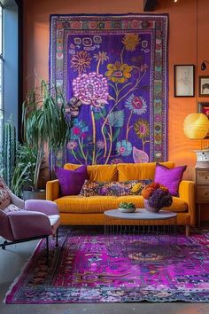 a living room filled with lots of furniture and colorful rugs on the wall next to a window