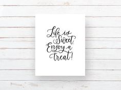 a black and white print with the words life is sweet enjoy a treat on it