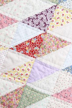 a close up view of a colorful quilt