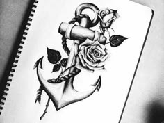 a pencil drawing of an anchor and rose