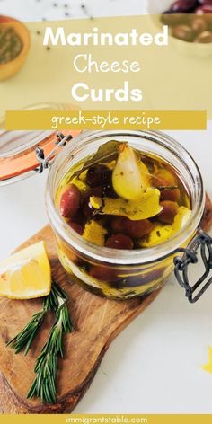 marinated cheese curls in a jar with lemons and rosemary