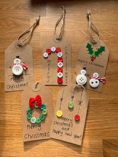 four christmas gift tags with buttons attached to them