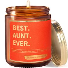 an orange jar with a gold lid and the words best aunt ever on it