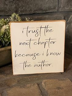 a sign that says trust the next charter because i know the author is in front of a potted plant