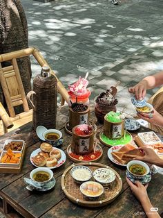 people sitting around a table with food on it