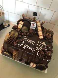 a chocolate birthday cake sitting on top of a counter