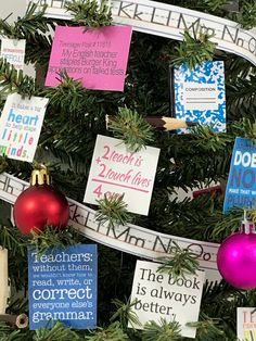 a christmas tree decorated with different types of greetings and notes on it's branches