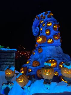 pumpkins carved into the shape of a castle at night