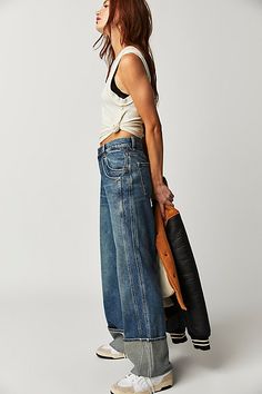 So slouchy and cool, these jeans from our We The Free collection are the perfect off-duty pair. **Fit:** Low-slung, slouchy wide-leg silhouette designed to be worn low on the hips **Features:** Six-pocket design, sewn cuffed hemlines, zip fly and button closure, lightweight rigid denim **Why We ❤ It:** Effortless with a baby tee or elevated with a billowy blouse, this pair has endless ways to wear. | We The Free Final Countdown Cuffed Low-Rise Jeans at Free People in Medium Wash, Size: 29 S Final Countdown, Slouchy Jeans, Chic Blazer, Stretch Denim Fabric, All Jeans, Denim Day, Denim Branding, Low Rise Jeans, Mid Rise Jeans