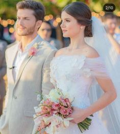 the bride and groom are walking down the aisle