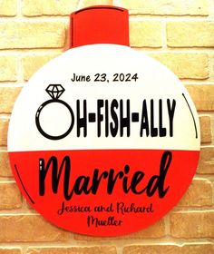 a red and white sign that says oh - fish - ally married with a diamond ring on it