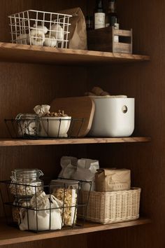 some shelves with baskets and food items on them