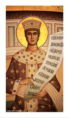 an icon of st nicholas the great holding a sheet of paper with russian text on it