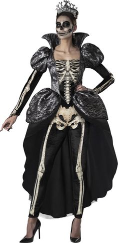 a woman in skeleton makeup and dress with her hands on her hips, posing for the camera