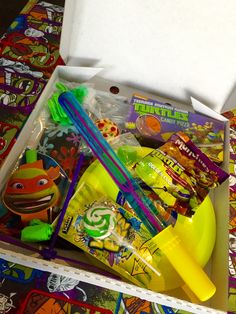 a box filled with assorted items on top of a table