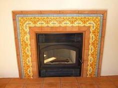 a fire place in a living room with tiled flooring and an orange tile fireplace