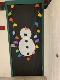 a decorated door with a snowman on it