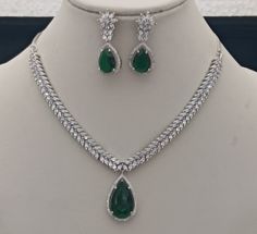 Meena Green CZ Diamonds Necklace Earrings Jewellery Set, Bridal Dangler Earrings, Bridal V Shape Necklace, Party Wear Silver Necklace ITEM DESCRIPTION Metal        = Silver Plated Occasion  = Wedding, Party Wear, Bridal Color        =  As per your order Size          = Necklace Length = 14 CM Long, Earring Size = 4 CM Inches Necklace Weight = 34 Gram Earrings Weight  = 6 Gram This necklace set comes with two matching earrings and a silver plated chain.  Free Shipping 100% Satisfaction Guarantee: Jewellery Set Bridal, Diamonds Necklace, Dangler Earrings, Jewellery Set, Cz Diamond, Necklace Earrings, V Shape, Matching Earrings, Necklace Set