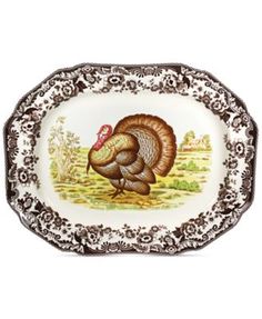 a white and brown plate with a turkey on it