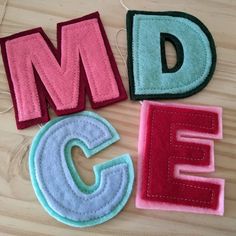 the letters are made out of felt and thread