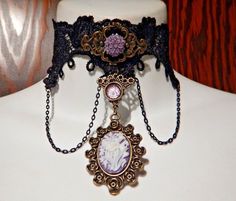 black lace necklace with bronze and lavender flower cameos, and black chains.  adjusts between 11 to 14" with chain,  so fits between 10 to 13.5" necks.  that's fairly slender. Lots of other lace chokers, and also matching lace cuffs, are available in my other listings in my eBay store. Victorian Metal Choker Necklace, Victorian Hallmarked Purple Necklace, Gothic Costume Jewelry Choker, Black Victorian Choker Necklace, Victorian Gothic Choker, Black Lace Necklace, Victorian Collar, Lace Cuffs, Lace Necklace