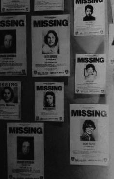 many missing posters are hanging on the wall